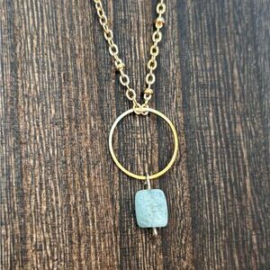 Gold Circle Pendant with Aquamarine chip on gold tone chain